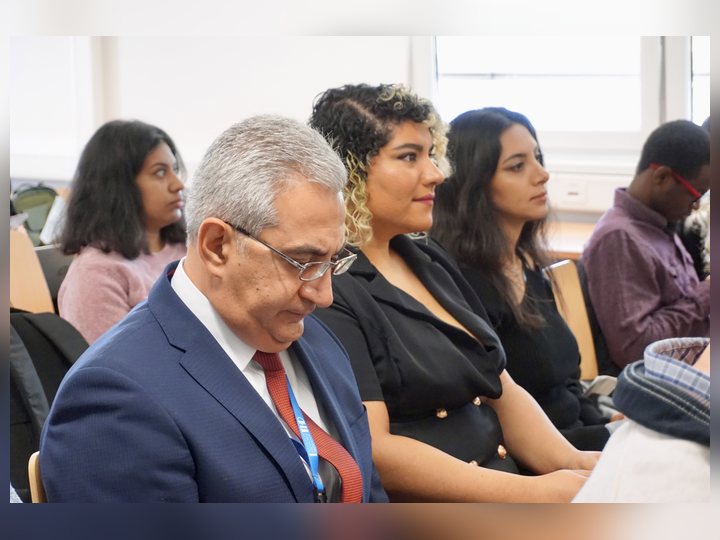 Prof. Georgi Chaltikyan is listening during a scientific presentation