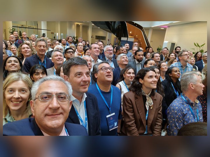 Prof. Georgi Chaltikyan taking a group selfie with symposium participants