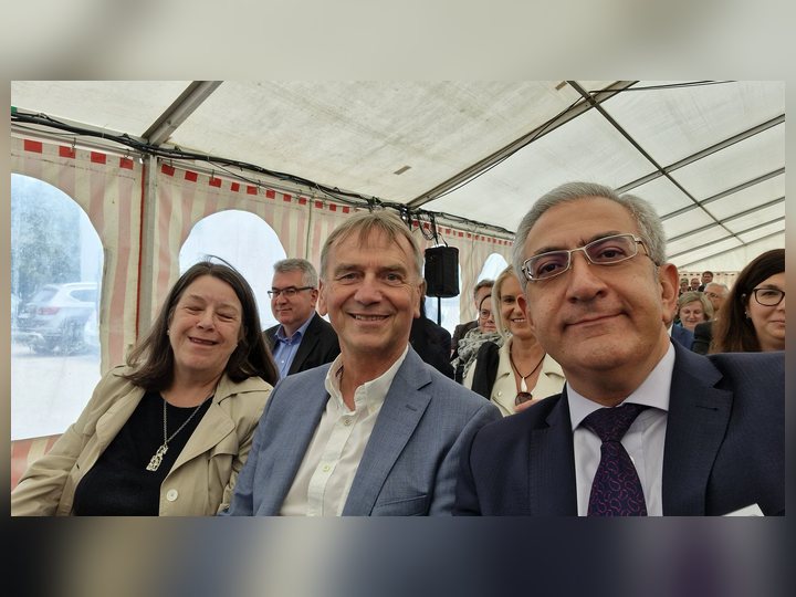 Selected photograph from European Campus Rottal-Inn Anniversary, showing colleagues and participants in conversation
