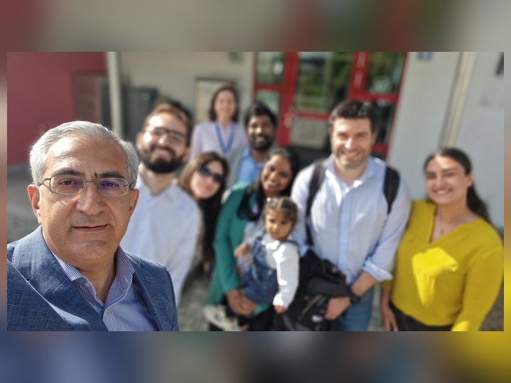 Prof. Georgi Chaltikyan taking a group selfie with visiting participants during Interoperability Week 2026