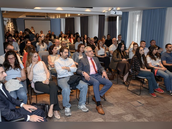 Prof. Georgi Chaltikyan joining participants during a conference session