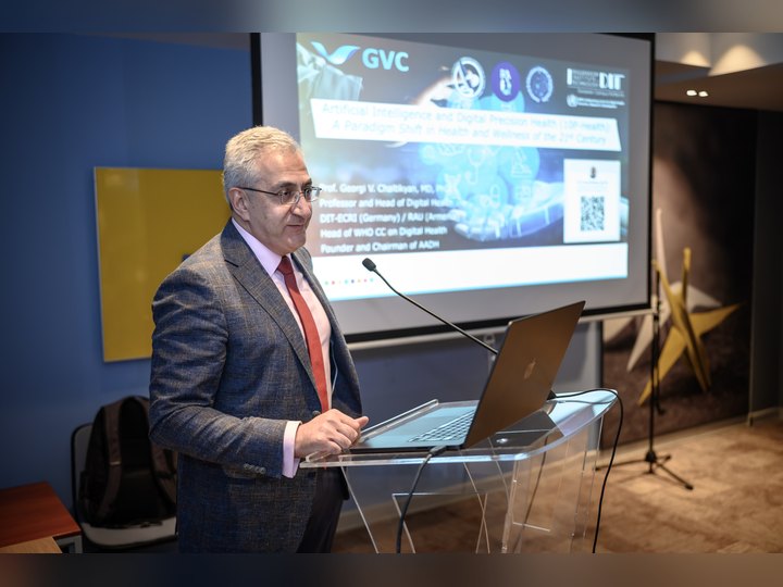 Prof. Georgi Chaltikyan presenting on artificial intelligence and digital precision health