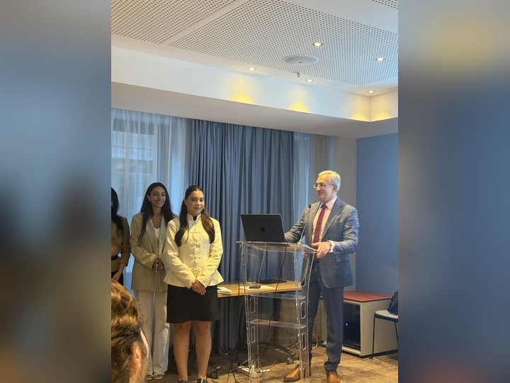 Prof. Georgi Chaltikyan presenting a graduation certificate